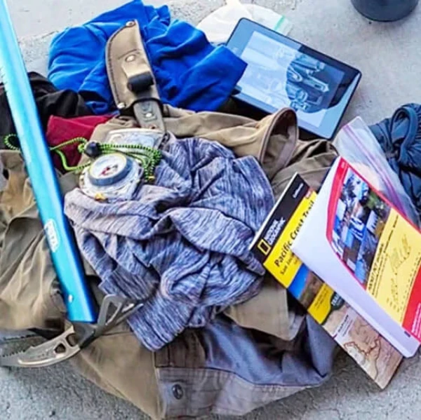 A pile of extra clothes being sent home.